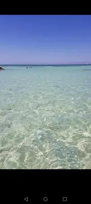 a large body of water with rocks in it at Hurghada - star beach water front chalets - 3BR in Hurghada