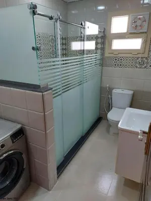 a bathroom with a washing machine and a toilet at Hurghada - star beach water front chalets - 3BR in Hurghada