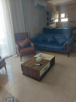 a living room with a couch and a coffee table at Hurghada - star beach water front chalets - 3BR in Hurghada
