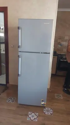 a white refrigerator in a kitchen next to a stove at Hurghada - star beach water front chalets - 3BR in Hurghada