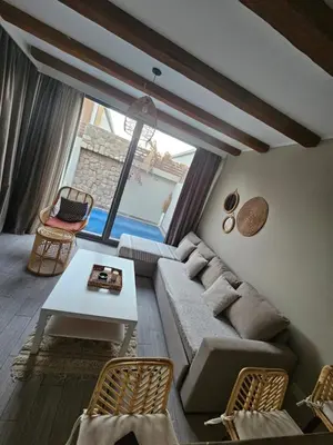 a living room with a couch and a table at One Bedroom private pool in Hurghada