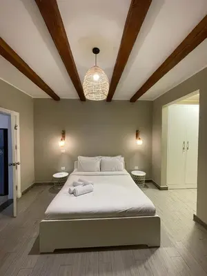 a bedroom with a large bed with two towels on it at One Bedroom private pool in Hurghada