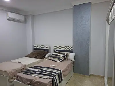 two beds in a small room with at Luxury family apartment in Hurghada in Hurghada