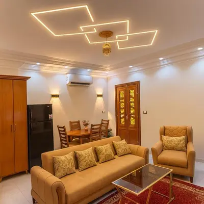 a living room with a couch and a table at Oscar Apartment 10 in Luxor