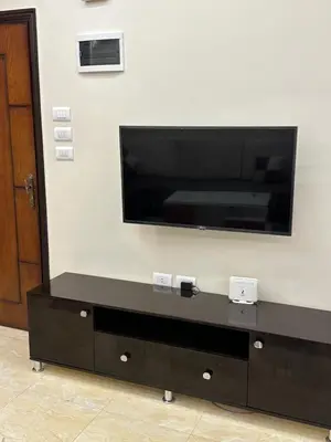 a flat screen tv hanging on a wall at الوفاء امام فندق بيروت in Hurghada