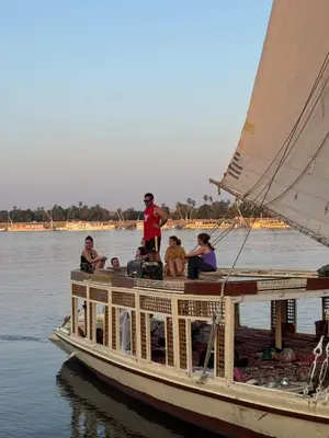 a group of people on a boat on the water at Traditional Felucca Sailing Boat Overnight in Aswan
