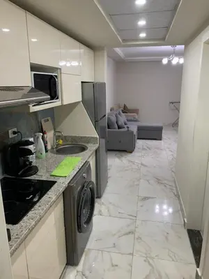a kitchen with a washer and dryer in a room at Happy Home Hurghada in Hurghada