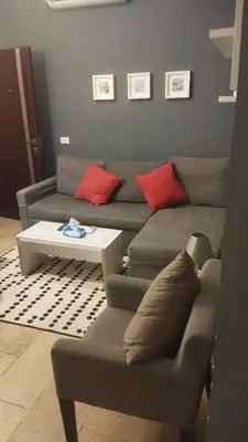 a living room with a couch and a coffee table at Kite Lodging Hotel in Hurghada