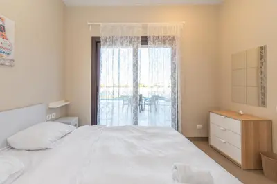 a bedroom with a white bed and a window at 4 Bdr Villa with private heated pool in Sabina in Hurghada
