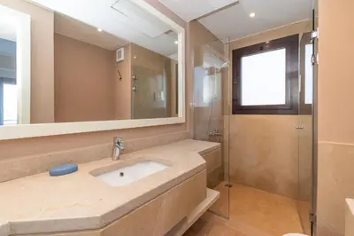 a bathroom with a sink and a shower at 4 Bdr Villa with private heated pool in Sabina in Hurghada