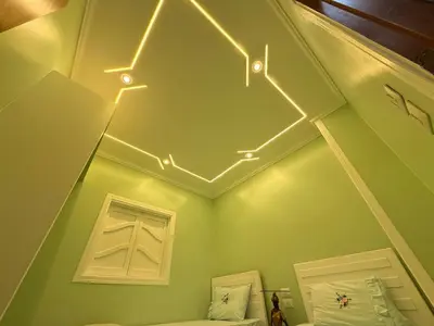 a room with a room with lights on the ceiling at Oscar apartment 5 in Luxor