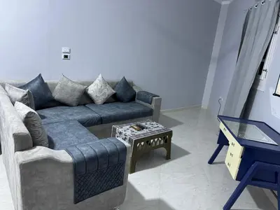 a living room with a couch and a table at Peace Homes in Quseir