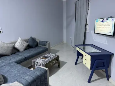 a living room with a couch and a table at Peace Homes in Quseir