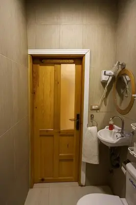 a bathroom with a toilet and a sink at Oscar Apartment 2 in Luxor