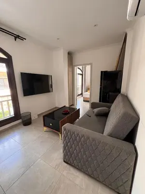 a living room with a couch and a coffee table at 201 Aqua Blue Bay in Hurghada
