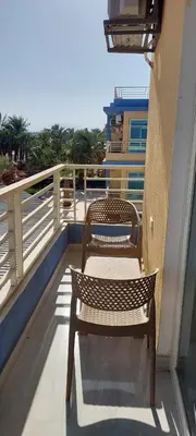 a bench sitting on the side of a balcony at Hurghada Aqua-Mirage Beach Resort in Hurghada