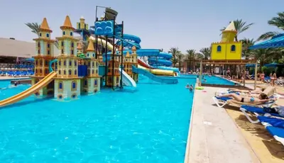 a pool at a resort with people in the water at فندق ميراج باي اكوا بارك in Hurghada