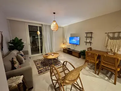 a living room with a couch and a table at M10-2b-04 mangrove in Hurghada