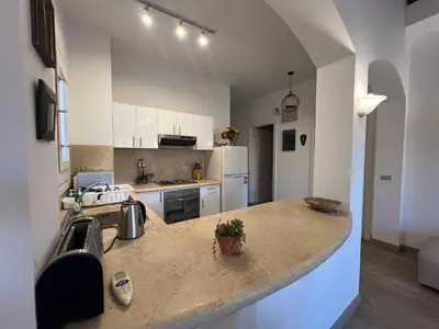 a kitchen with a large island in a room at Cozy South Marina 2Bdr with Pool Access in Hurghada