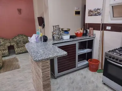 a kitchen with a counter top and a stove at شقة الغردقة in Hurghada