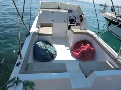 a white boat with a red ball and steps on the water at aladdin-travels-egy in Hurghada