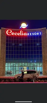 a car parked in front of a building with a sign at Cecelia Resort Hurghada H11 in Hurghada