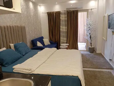 a bedroom with a large bed and a sink at Florenza khamsin Resort Hurghada P109 in Hurghada