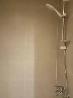 a shower with a shower head in a bathroom at Florenza khamsin Resort Hurghada P109 in Hurghada