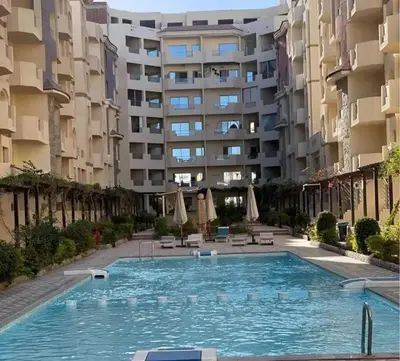 a large swimming pool in front of a building at Florenza khamsin Resort Hurghada P109 in Hurghada