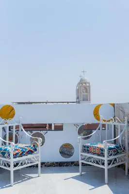 a group of chairs in front of a wall at Luxury Arabic Romantic Studio with its own large private Roof Terrace 15 mins from El Gouna in Hurghada
