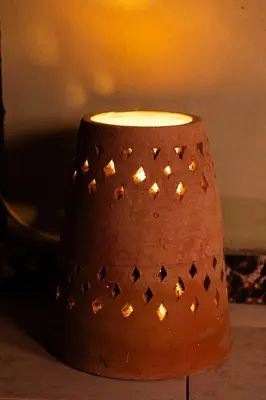 a brown vase with a light on top of it at Luxury Arabic Romantic Studio with its own large private Roof Terrace 15 mins from El Gouna in Hurghada
