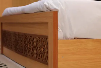 a close up of a wooden foot board of a bed at Luxury Arabic Romantic Studio with its own large private Roof Terrace 15 mins from El Gouna in Hurghada