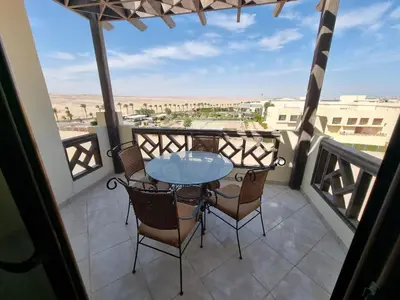 a patio with a table and chairs on a balcony at studio in Hotel Gravity 5 stelle in Hurghada