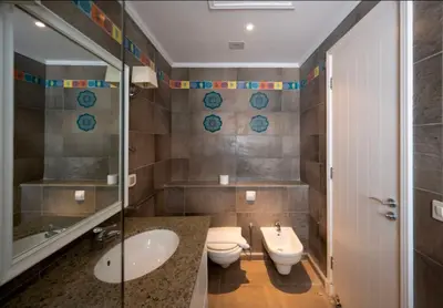 a bathroom with a sink and a toilet at Luxury Stays in Golf Town Houses in Hurghada