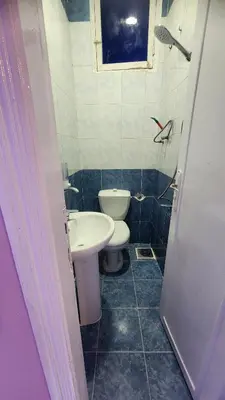 a small bathroom with a toilet and a sink at Shapon Hotel - Hurghada in Hurghada