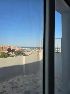 a view of the beach from a window of a building at Gomla Flats in Hurghada