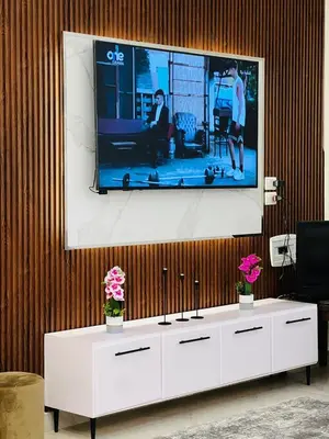 a flat screen tv hanging on a wall at Twins Villa Luxor in Luxor