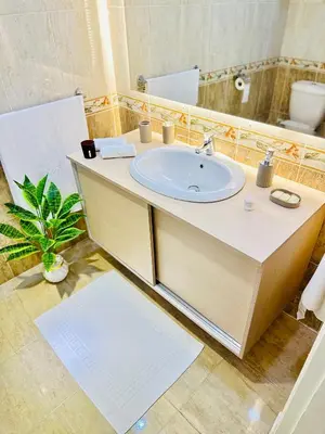 a bathroom with a sink and a mirror at Azure horizon,Karma Aqua beach resort,Hurghada in Hurghada