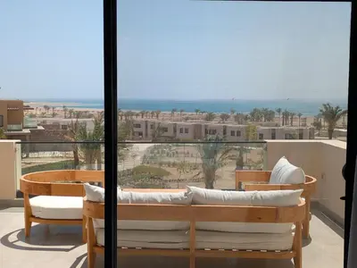 a balcony with a view of the ocean at Stunning Penthouse Seaview Apt in Mesca, Somabay in Hurghada