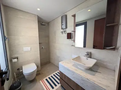 a bathroom with a white toilet and a sink at Stunning Penthouse Seaview Apt in Mesca, Somabay in Hurghada