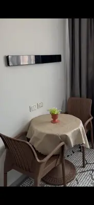 a table with a plant on it in a room at غرفه فندقيه in Hurghada