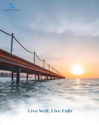 a bridge over the water with the sunset in the background at غرفه فندقيه in Hurghada
