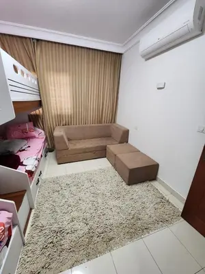 a small room with a bed and a couch at Luxury apartment with sea view and private beach in Hurghada