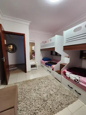 a room with two bunk beds and a doorway at Luxury apartment with sea view and private beach in Hurghada