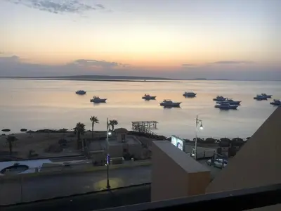 a view of a large body of water with boats in it at Luxury apartment with sea view and private beach in Hurghada