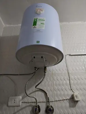 a white lamp is attached to a wall at room 4 a room in Hostel of 4 rooms in Hurghada
