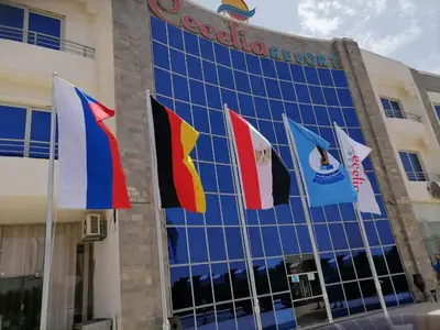 a group of flags on the side of a building at cecelia resort in Hurghada