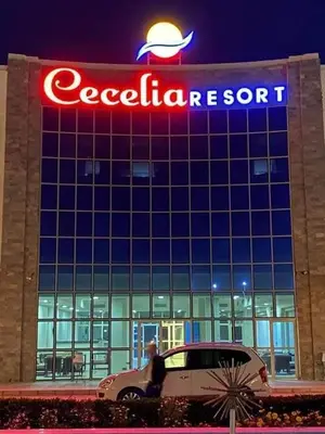 a car is parked in front of a car dealership at cecelia resort in Hurghada
