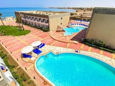 an overhead view of a swimming pool at a resort at cecelia resort in Hurghada