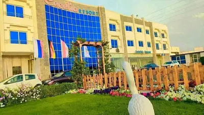 a statue of a swan in front of a building at cecelia resort in Hurghada